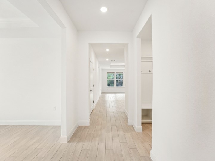 312 Kitty Hawk Road Georgetown, TX 78633 - Photo 7 of 37 a view of a hallway with wooden floor