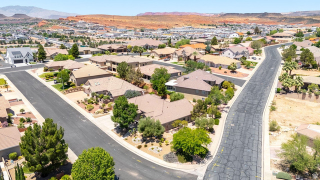 1609 East 10 S Street St. George, UT 84790 - Photo 64 of 68 Aerial perspective showcasing a residential neighborhood with varied architectural styles and mature landscaping