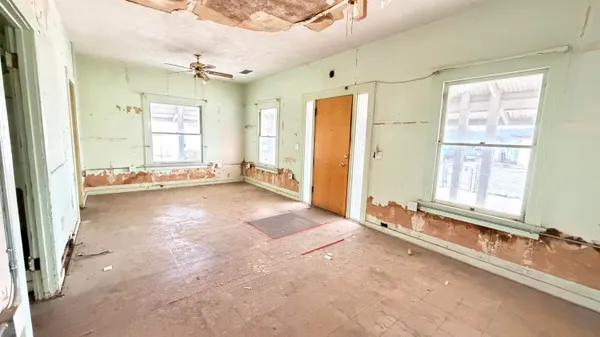 a view of a room with large windows