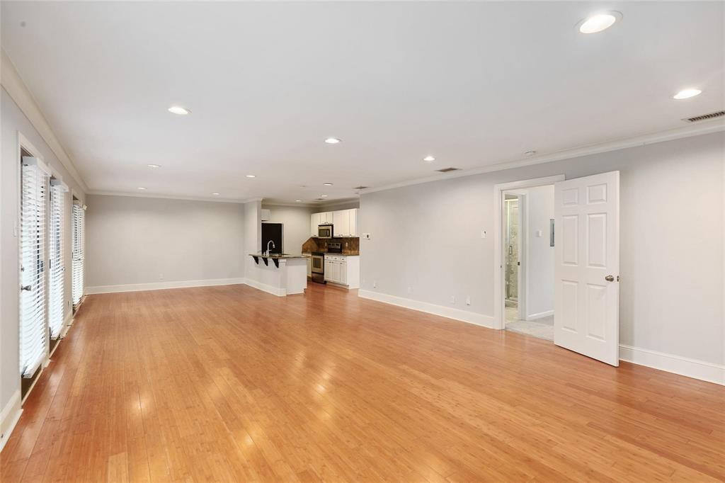 7770 Meadow Road, Unit 211 Dallas, TX 75230 - Photo 7 of 12 a view of empty room with wooden floor