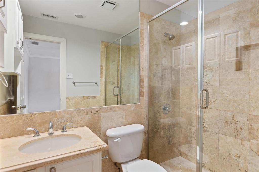 7770 Meadow Road, Unit 211 Dallas, TX 75230 - Photo 10 of 12 a bathroom with a sink toilet and shower