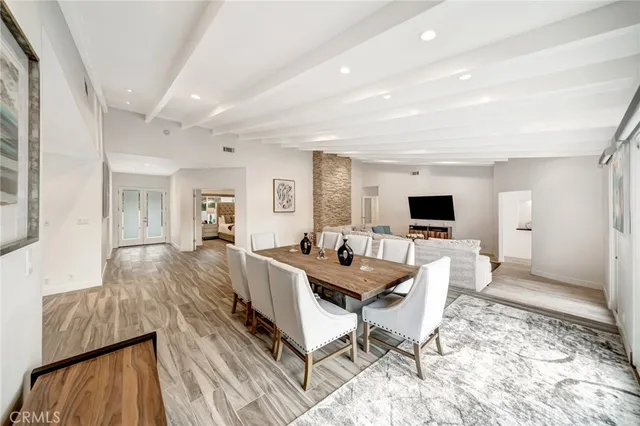 a kitchen with stainless steel appliances a stove a sink and a microwave