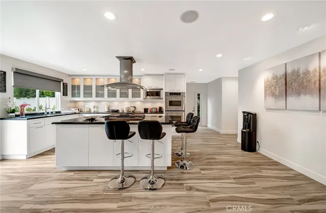 a bedroom with a large bed and a couch