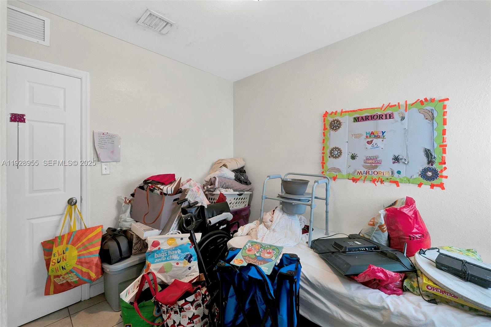 1910 Northwest 72nd Street Miami, FL 33147 - Photo 15 of 37 a bedroom with toys and a couch