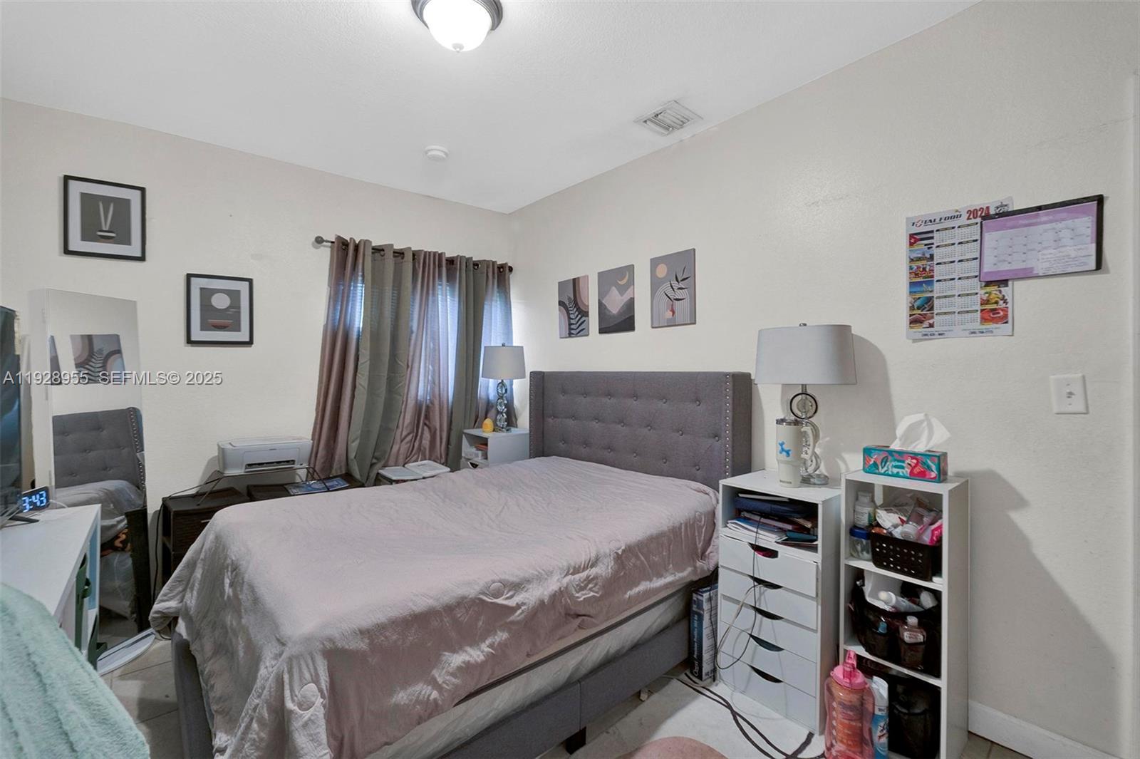 1910 Northwest 72nd Street Miami, FL 33147 - Photo 16 of 37 a bedroom with a bed and a closet