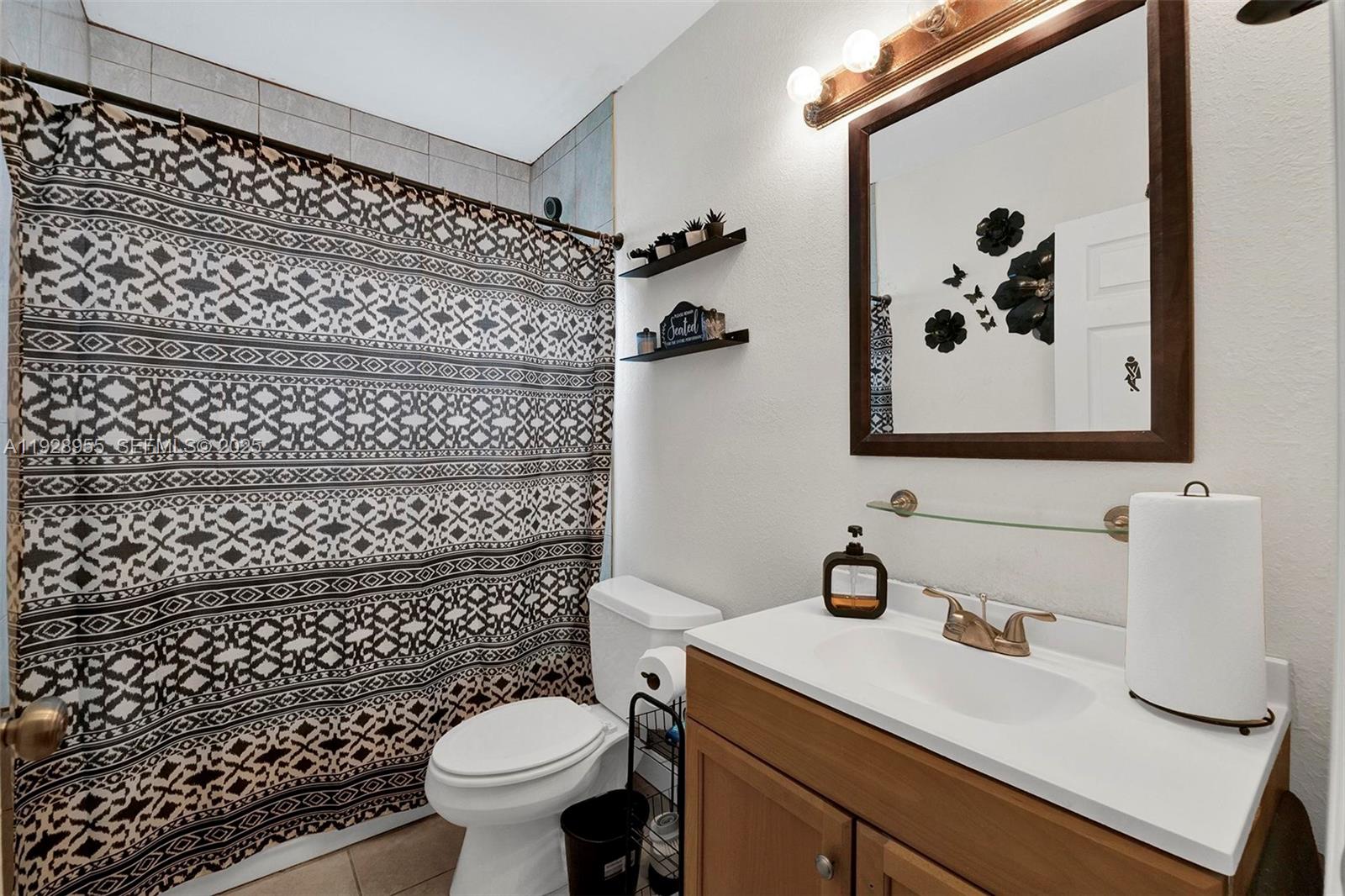 1910 Northwest 72nd Street Miami, FL 33147 - Photo 18 of 37 a bathroom with a sink toilet and a shower