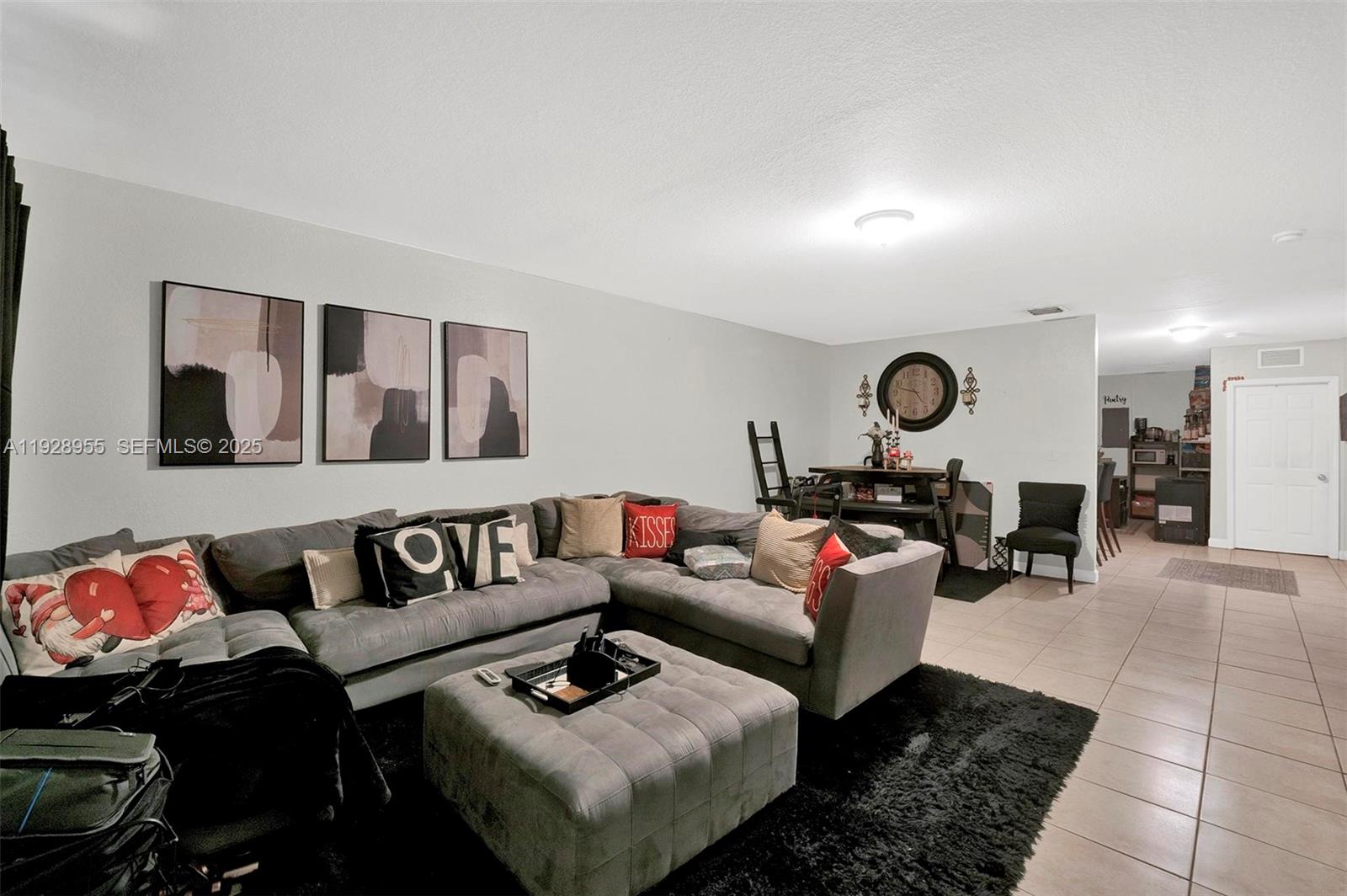 1910 Northwest 72nd Street Miami, FL 33147 - Photo 22 of 37 a living room with furniture and a rug