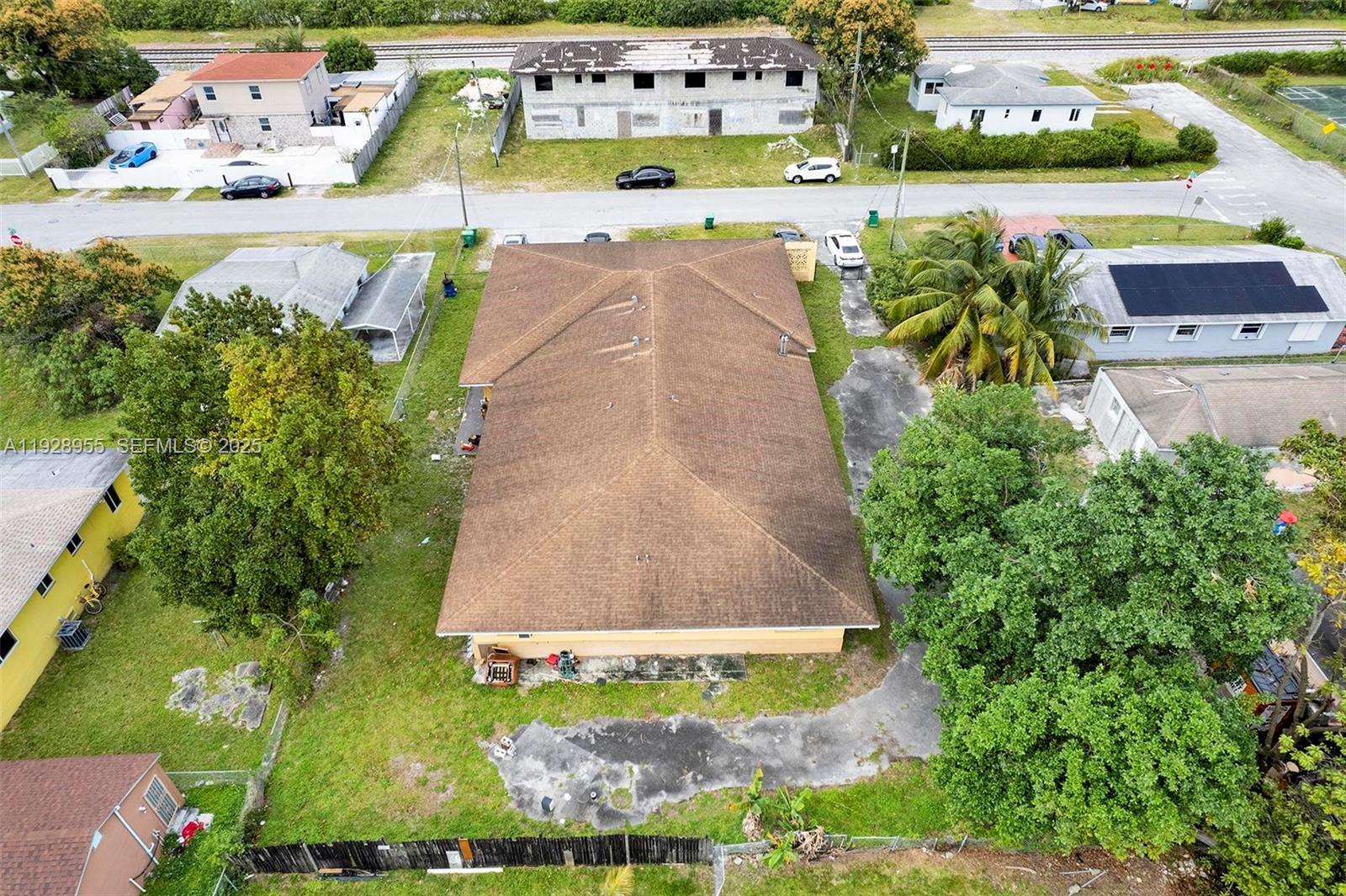 1910 Northwest 72nd Street Miami, FL 33147 - Photo 33 of 37 an aerial view of a house with a swimming pool yard and outdoor seating