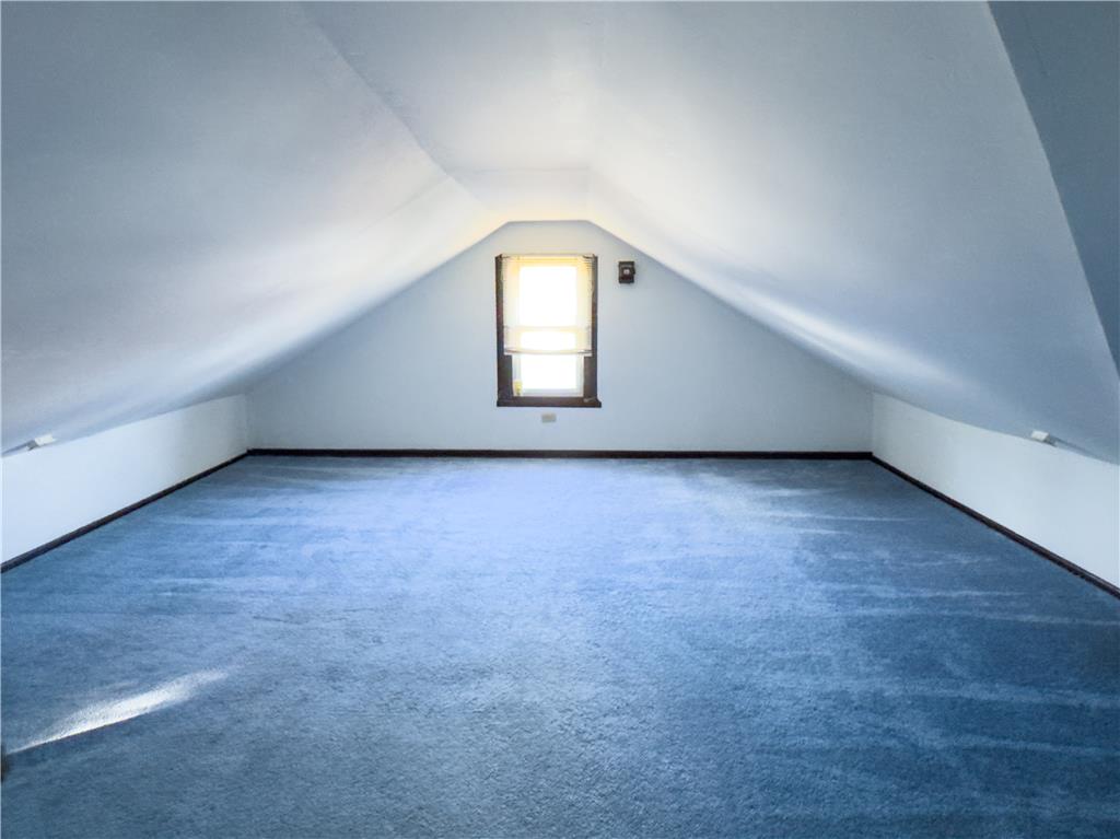870 Chestnut Street Coplay, PA 18037 - Photo 18 of 24 A well-lit attic space offers a window for natural light and sloped ceilings.