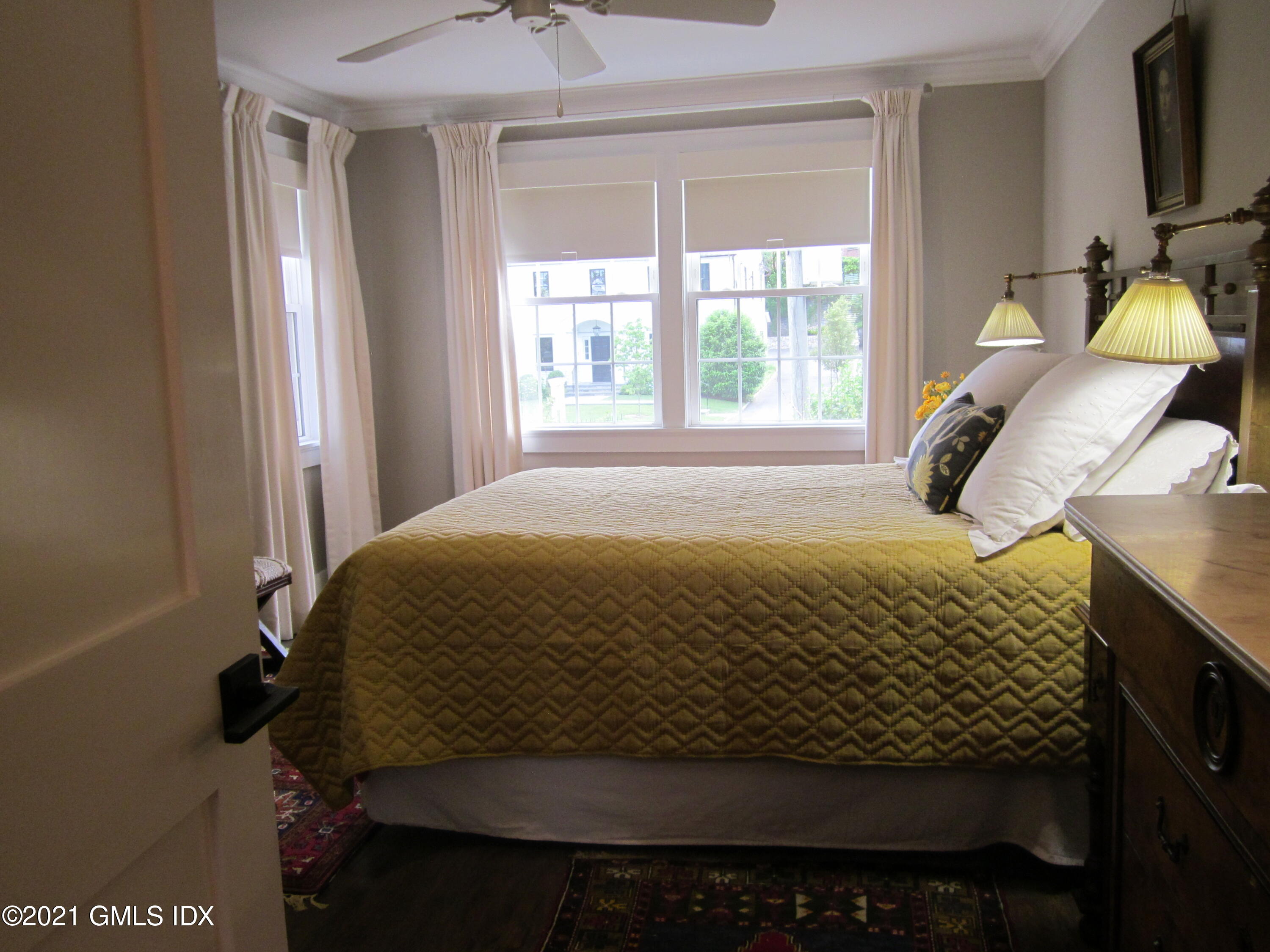 4 Putnam Park, Unit 4 Greenwich, CT 06830 - Photo 11 of 37 a bedroom with a bed and window