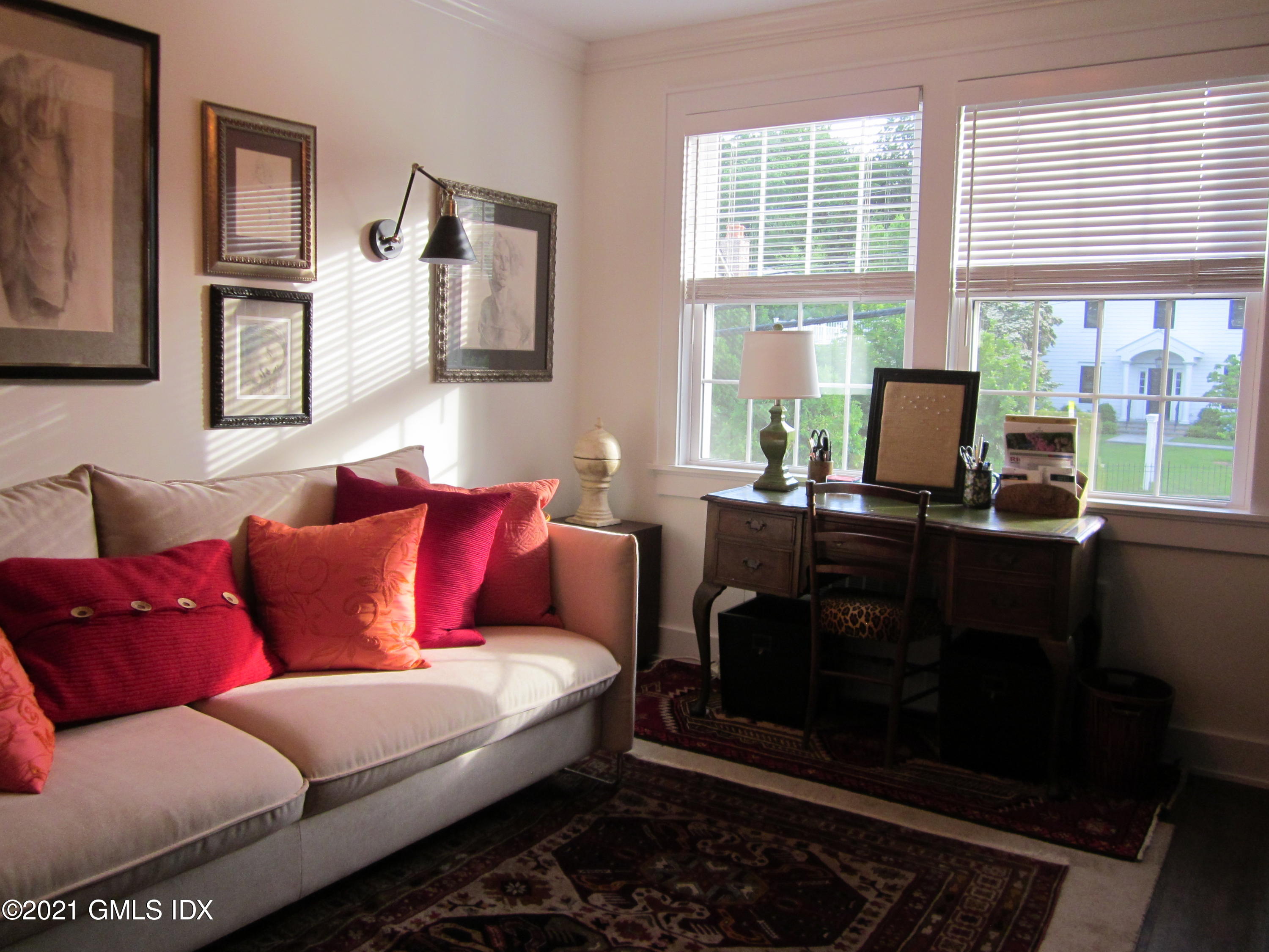 4 Putnam Park, Unit 4 Greenwich, CT 06830 - Photo 14 of 37 a living room with furniture and a fireplace
