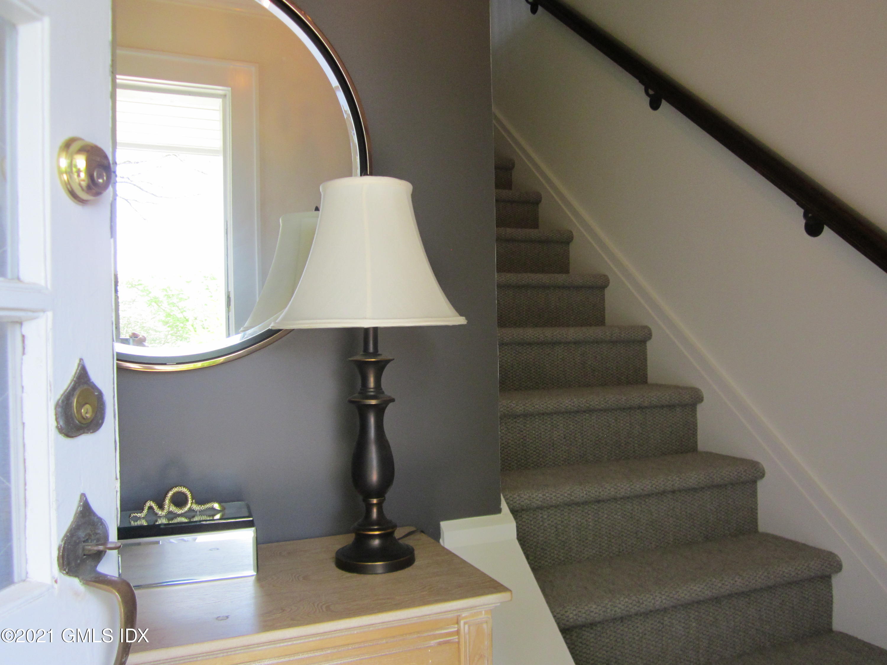 4 Putnam Park, Unit 4 Greenwich, CT 06830 - Photo 2 of 37 a view of entryway and hall with wooden floor