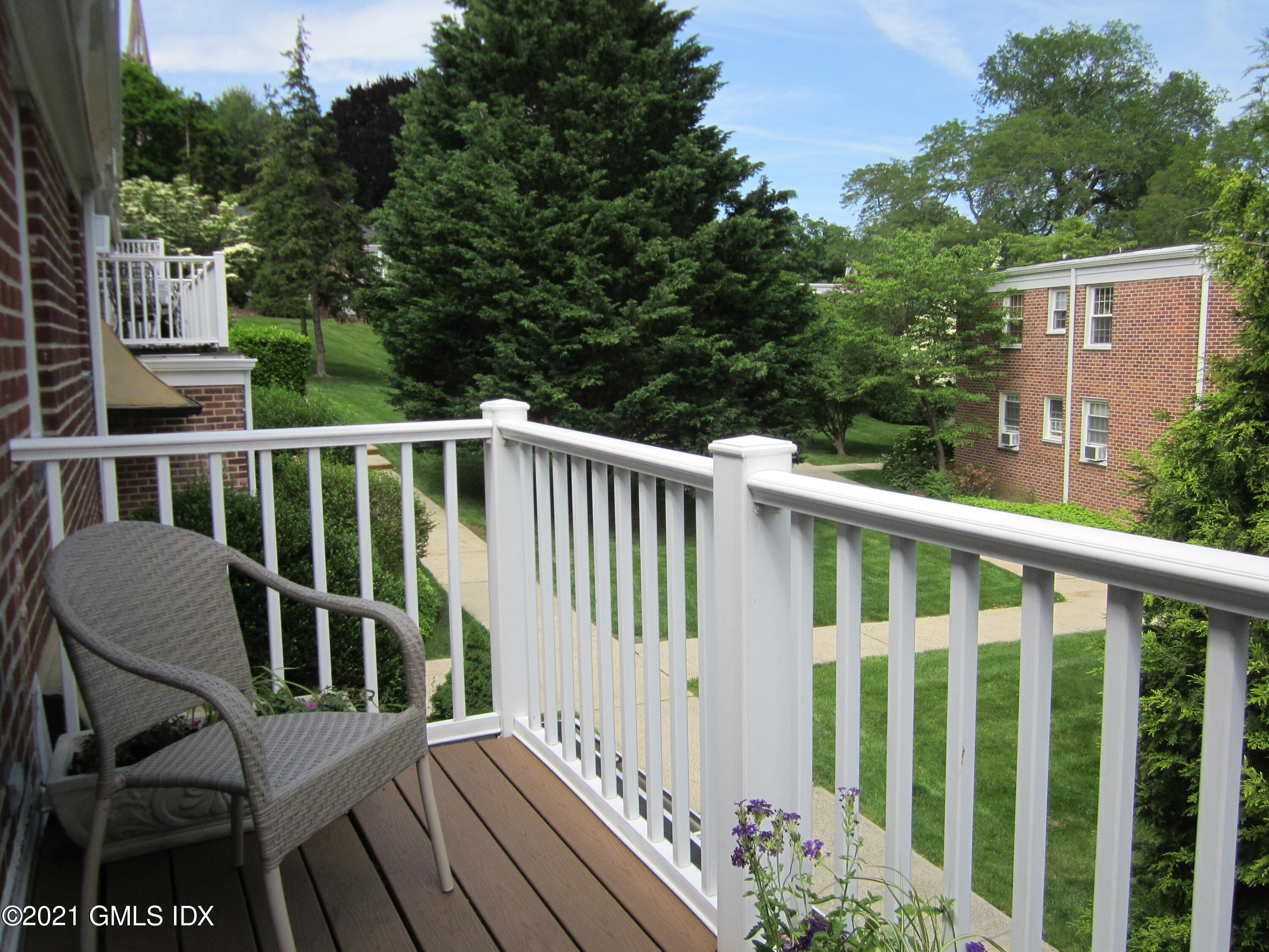 4 Putnam Park, Unit 4 Greenwich, CT 06830 - Photo 22 of 37 a view of a chair in wooden balcony