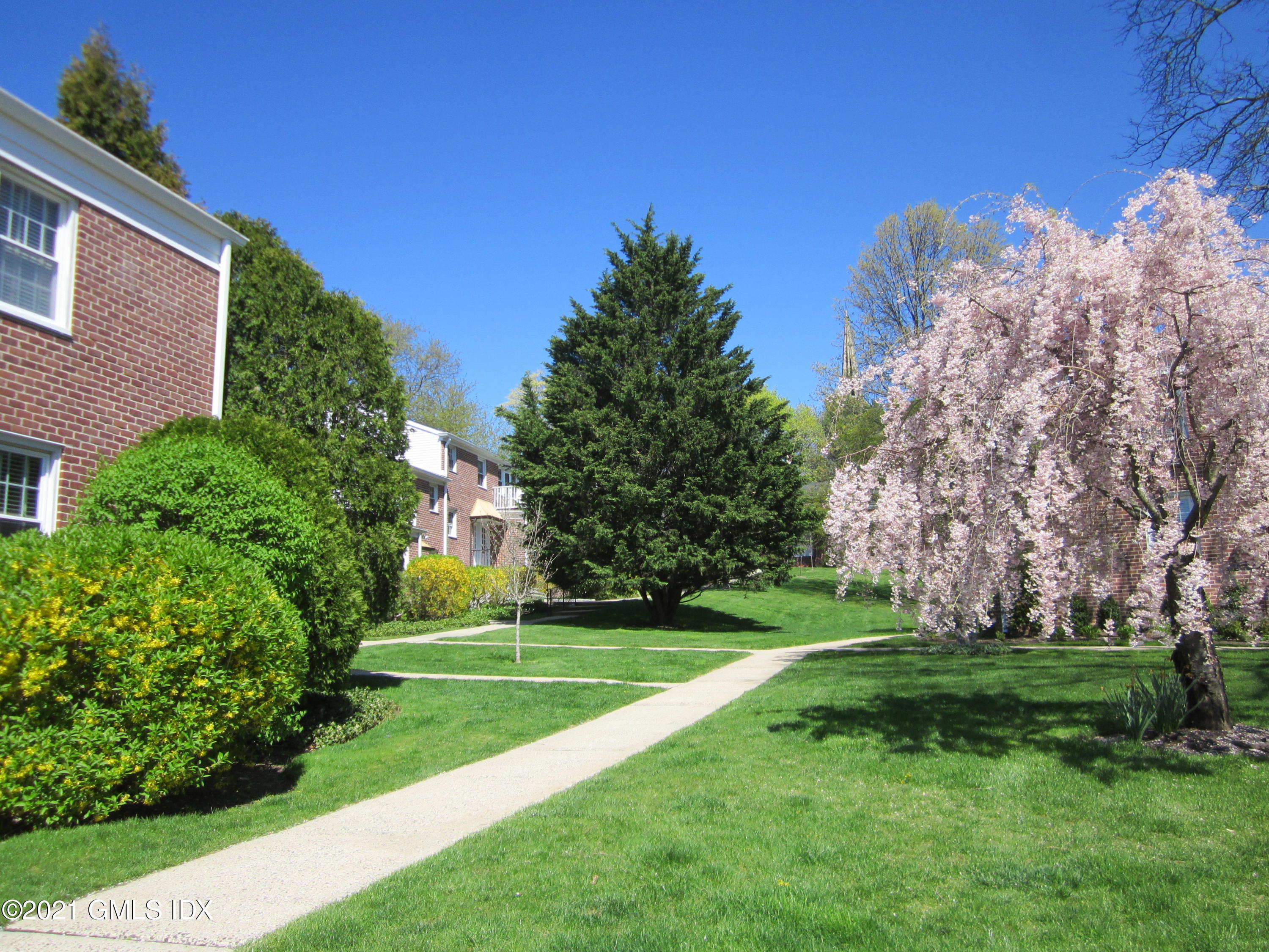 4 Putnam Park, Unit 4 Greenwich, CT 06830 - Photo 23 of 37 a view of a golf course with a garden