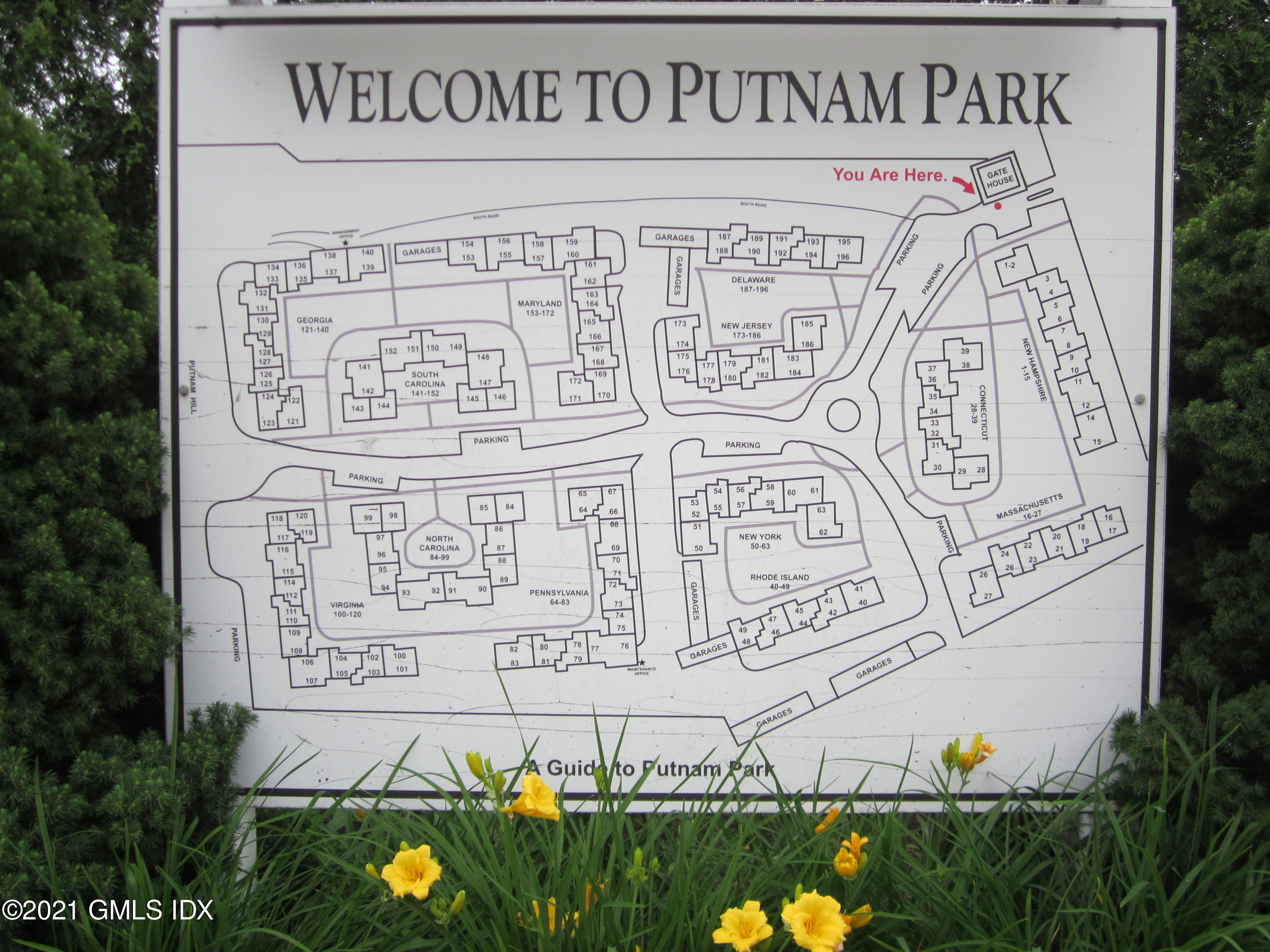 4 Putnam Park, Unit 4 Greenwich, CT 06830 - Photo 27 of 37 a sign on the side of a building