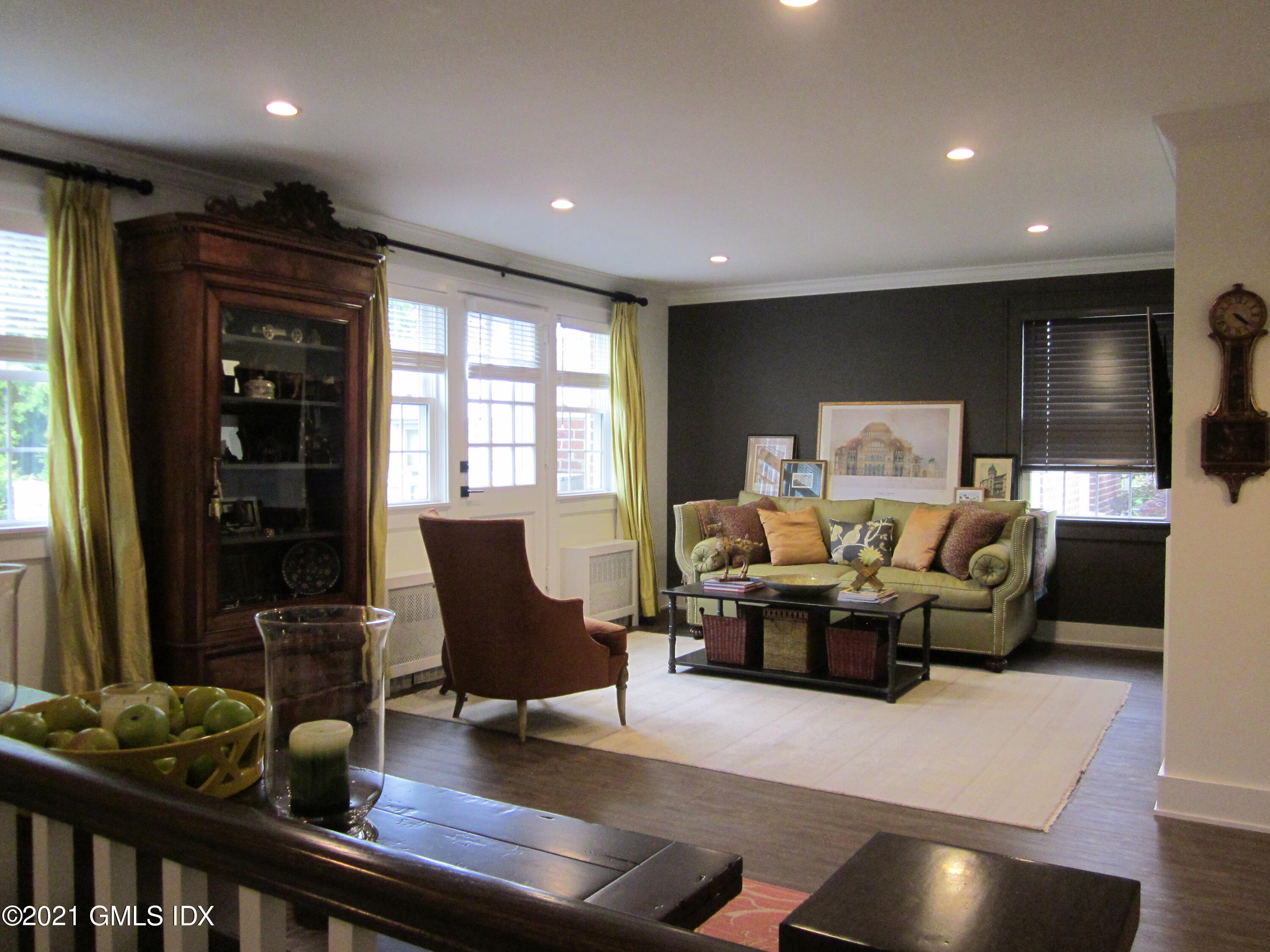 4 Putnam Park, Unit 4 Greenwich, CT 06830 - Photo 3 of 37 a living room with furniture and wooden floor
