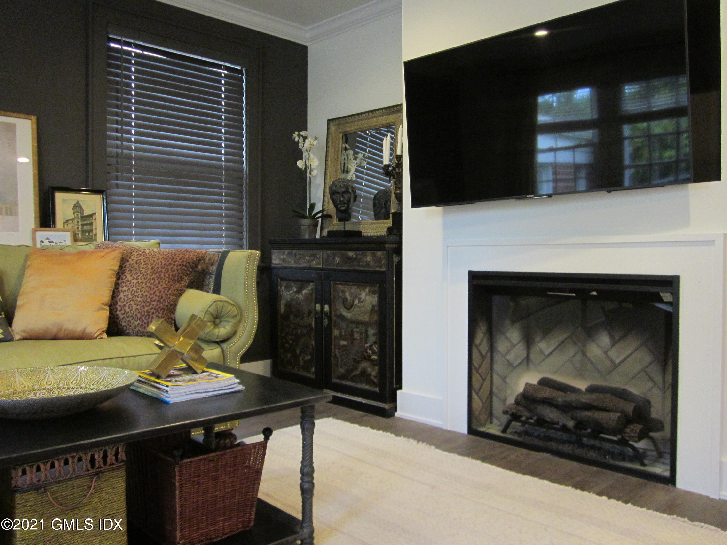 4 Putnam Park, Unit 4 Greenwich, CT 06830 - Photo 5 of 37 a living room with furniture and a fireplace