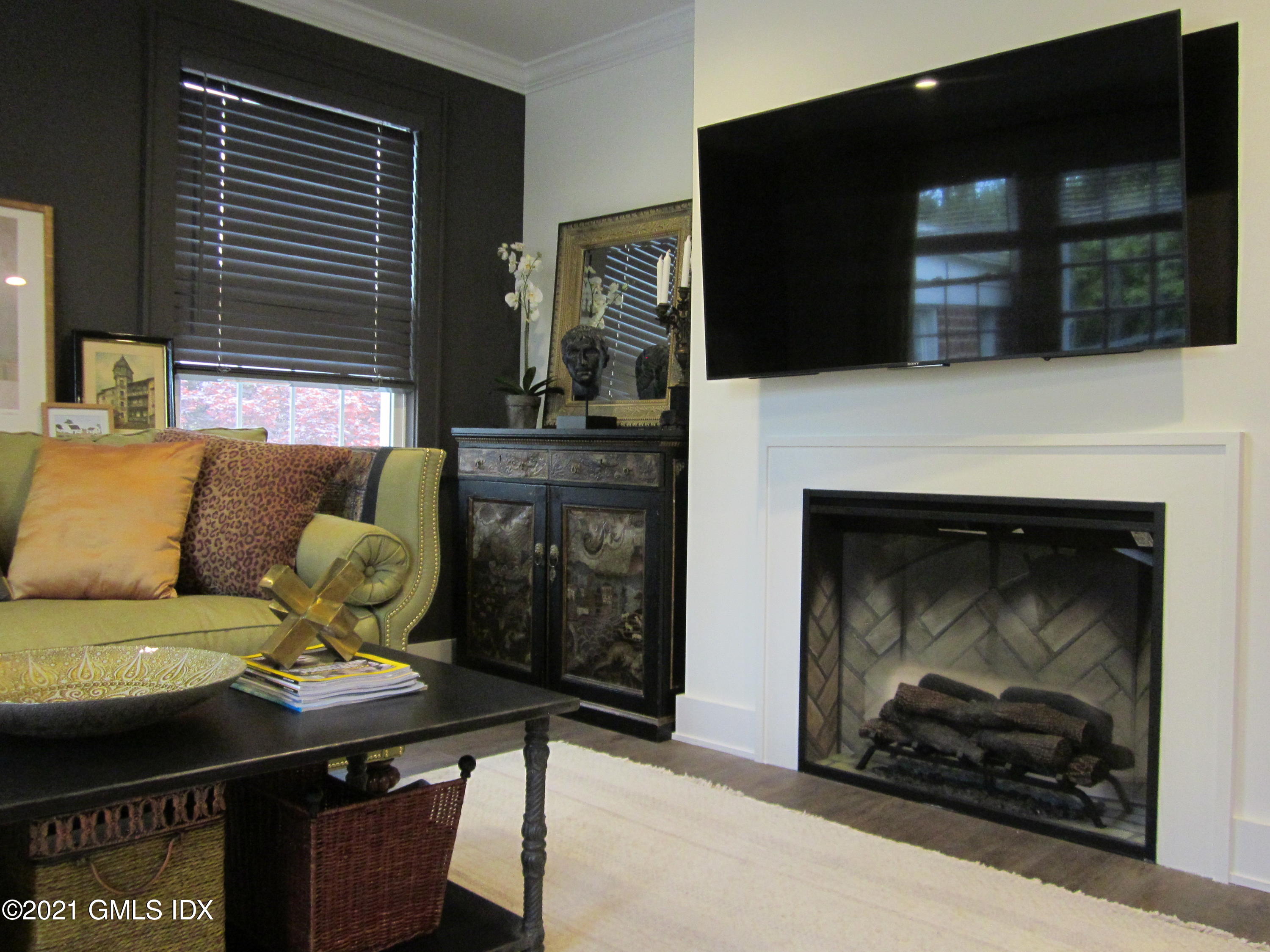 4 Putnam Park, Unit 4 Greenwich, CT 06830 - Photo 6 of 37 a living room with furniture and a fireplace