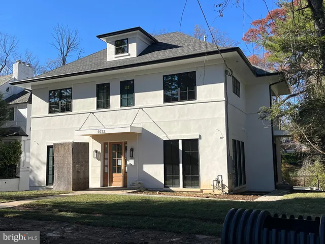 a view of balcony with wooden floor and fence