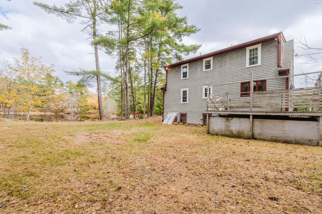 150 Quanapoag Road Freetown, MA 02717 - Photo 11 of 42 a view of a house with backyard and tree
