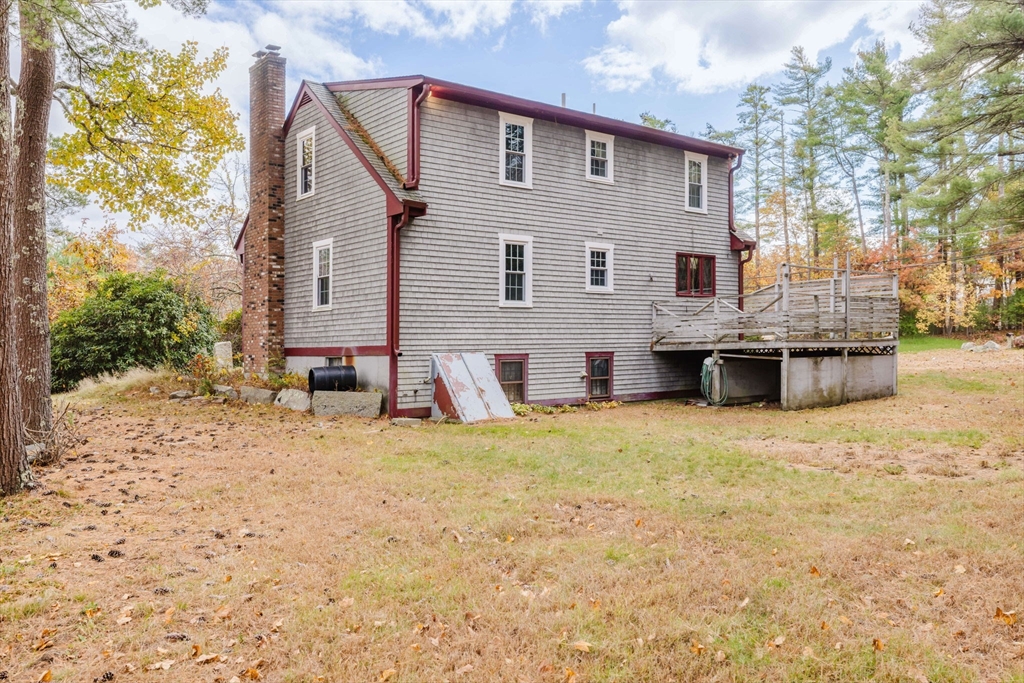 150 Quanapoag Road Freetown, MA 02717 - Photo 13 of 42 a view of back yard of the house