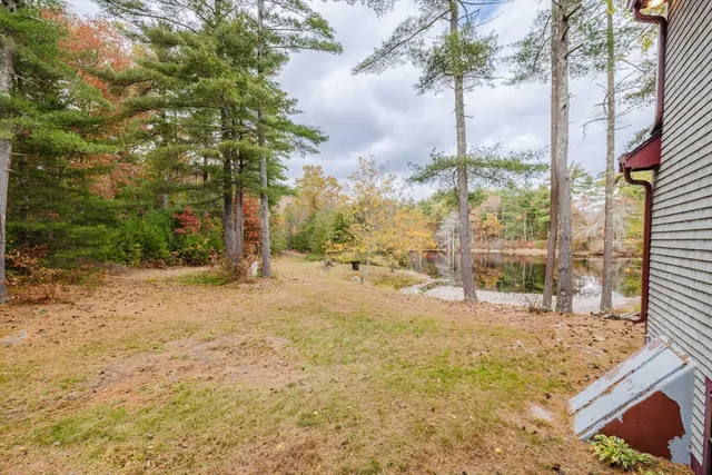 a view of a yard with snow on the road