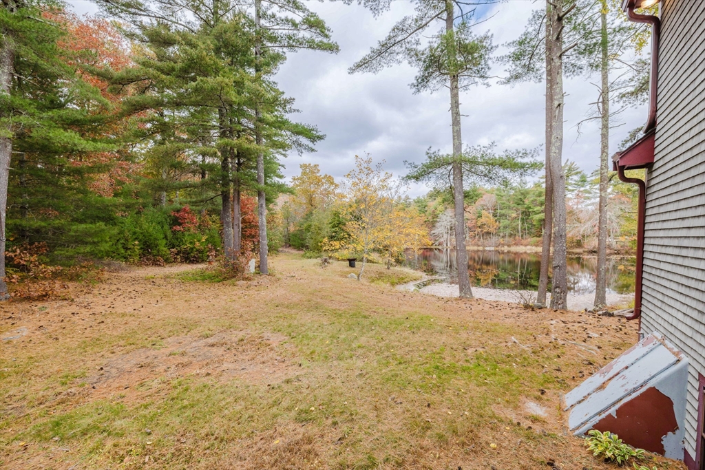 150 Quanapoag Road Freetown, MA 02717 - Photo 16 of 42 a view of a yard with snow on the road
