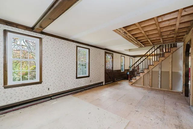 a view of an empty room with stairs