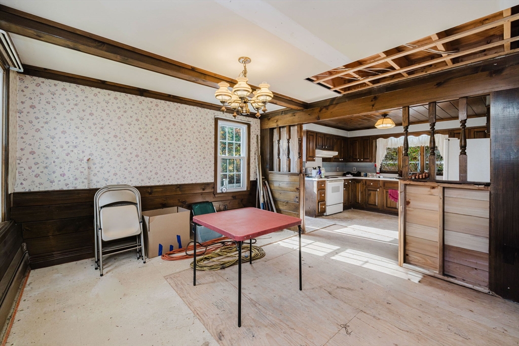 150 Quanapoag Road Freetown, MA 02717 - Photo 22 of 42 a patio with a table and chairs and a barbeque