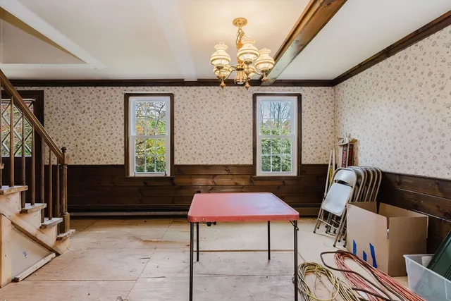 a view of balcony with a flat screen tv and windows