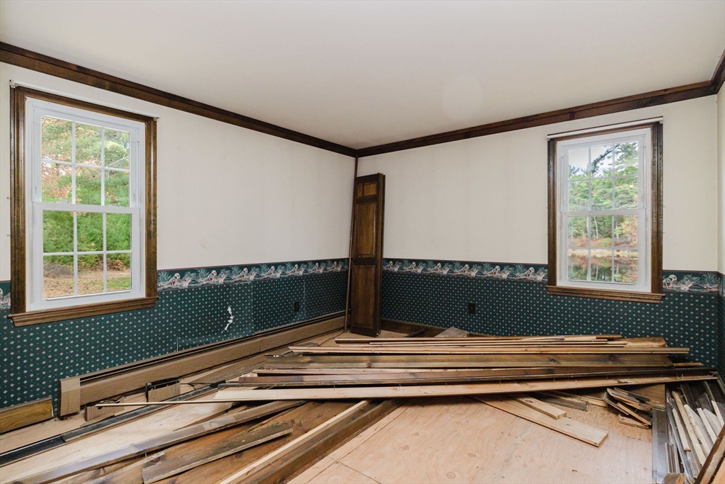 150 Quanapoag Road Freetown, MA 02717 - Photo 26 of 42 a view of balcony with a flat screen tv and windows