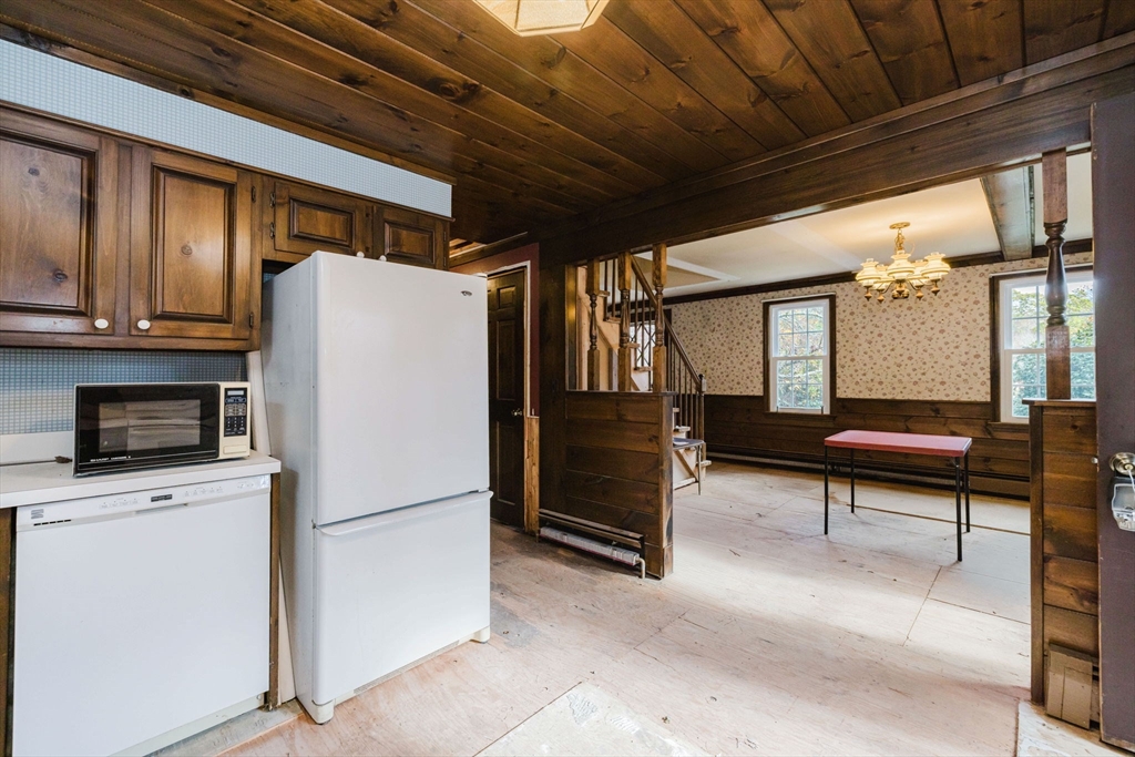 150 Quanapoag Road Freetown, MA 02717 - Photo 31 of 42 a kitchen with stainless steel appliances a refrigerator and a stove