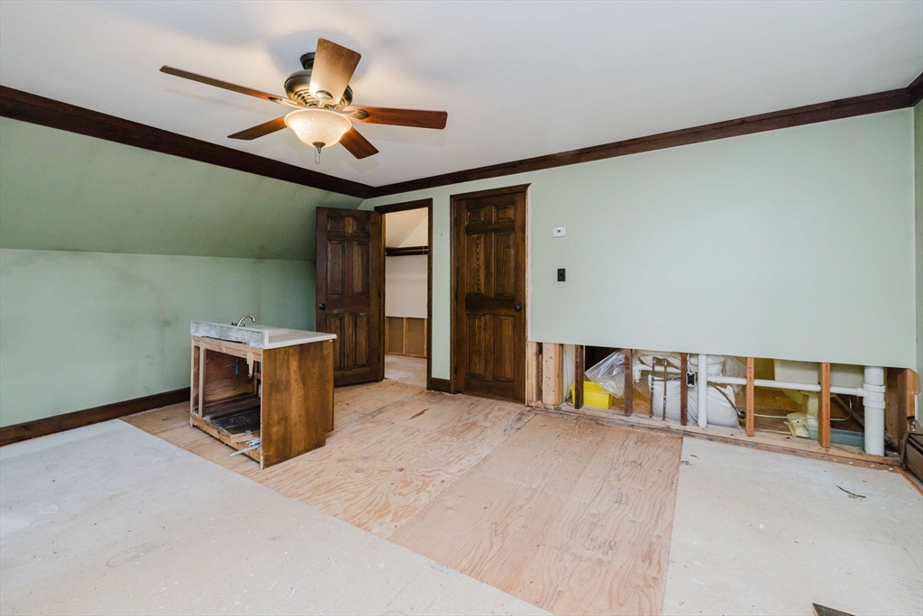 150 Quanapoag Road Freetown, MA 02717 - Photo 35 of 42 an empty room with ceiling fan and windows