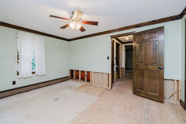 a view of a room with wooden walls