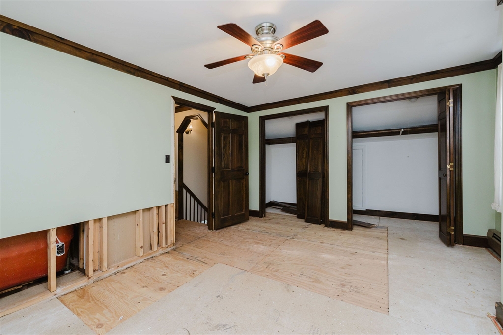 150 Quanapoag Road Freetown, MA 02717 - Photo 39 of 42 an empty room with closet and a ceiling fan
