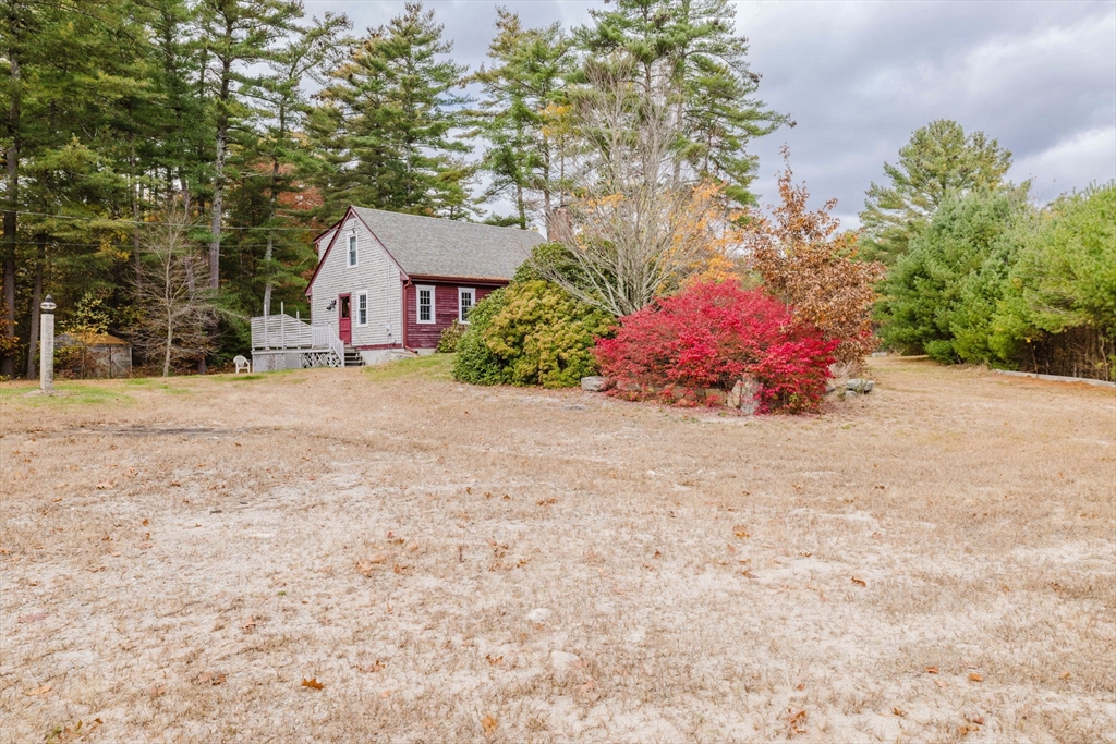 150 Quanapoag Road Freetown, MA 02717 - Photo 7 of 42 a front view of a house with a yard