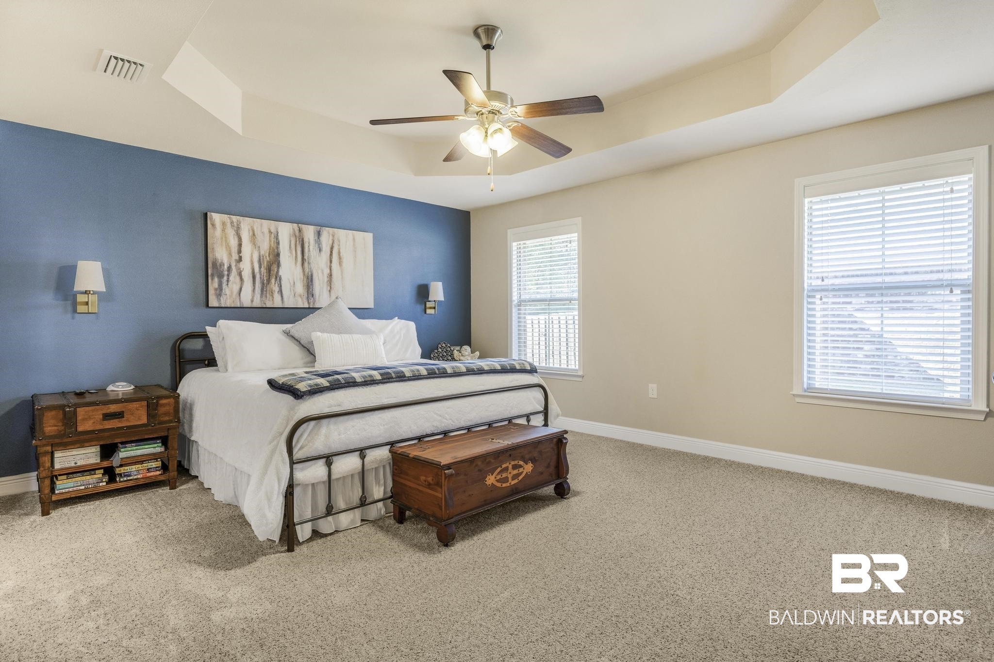 22043 Garland Loop Silverhill, AL 36576 - Photo 19 of 41 Bedroom featuring a raised ceiling, light carpet, and ceiling fan
