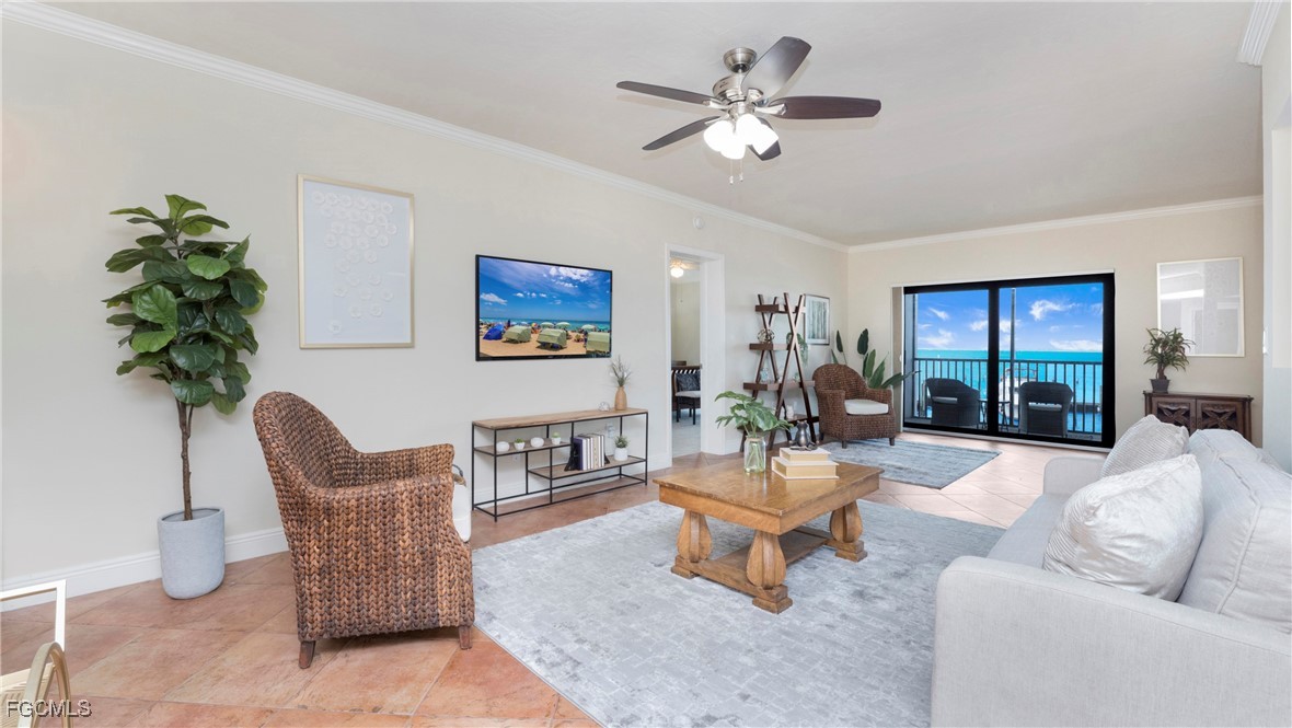 1920 Virginia Avenue, Unit 202 Fort Myers, FL 33901 - Photo 12 of 38 a living room with furniture a chandelier and a potted plant