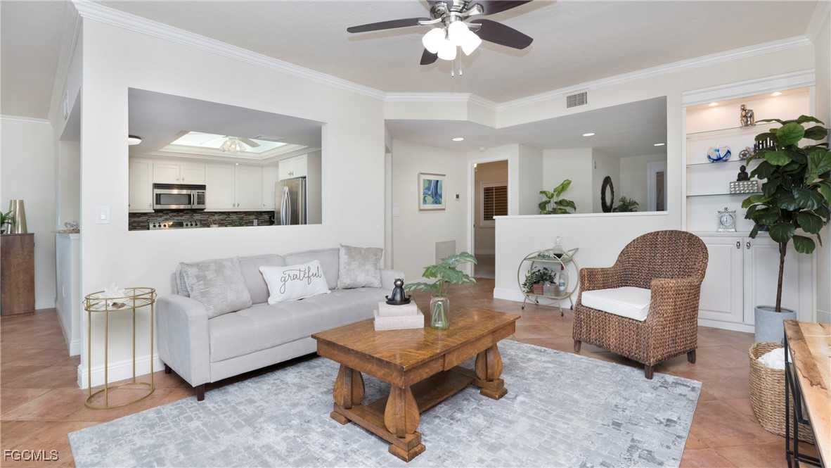 1920 Virginia Avenue, Unit 202 Fort Myers, FL 33901 - Photo 13 of 38 a living room with furniture and a large mirror