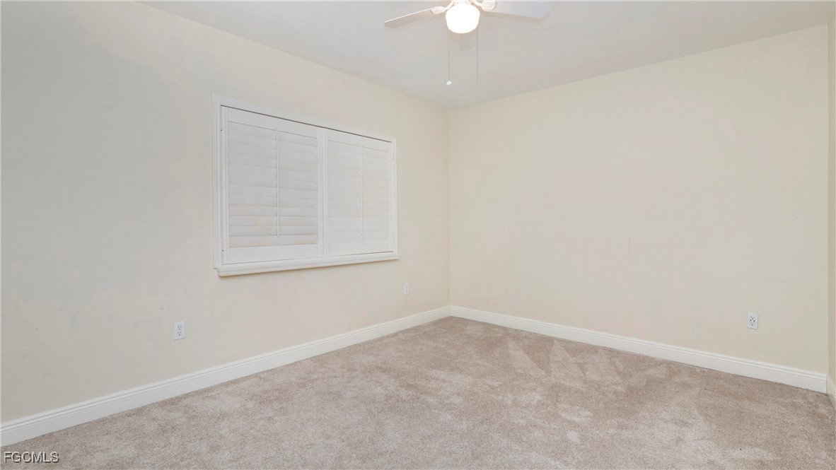 1920 Virginia Avenue, Unit 202 Fort Myers, FL 33901 - Photo 17 of 38 an empty room with a window