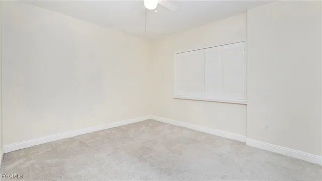 an empty room with closet area