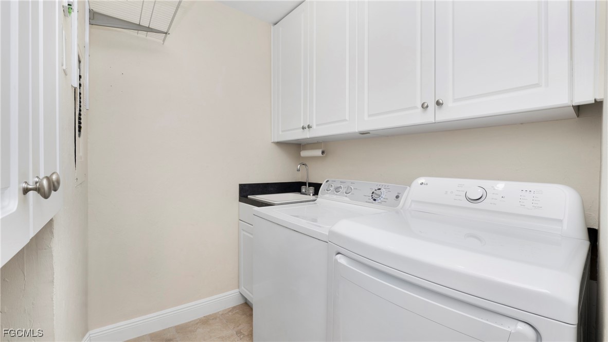 1920 Virginia Avenue, Unit 202 Fort Myers, FL 33901 - Photo 22 of 38 a utility room with dryer and washer