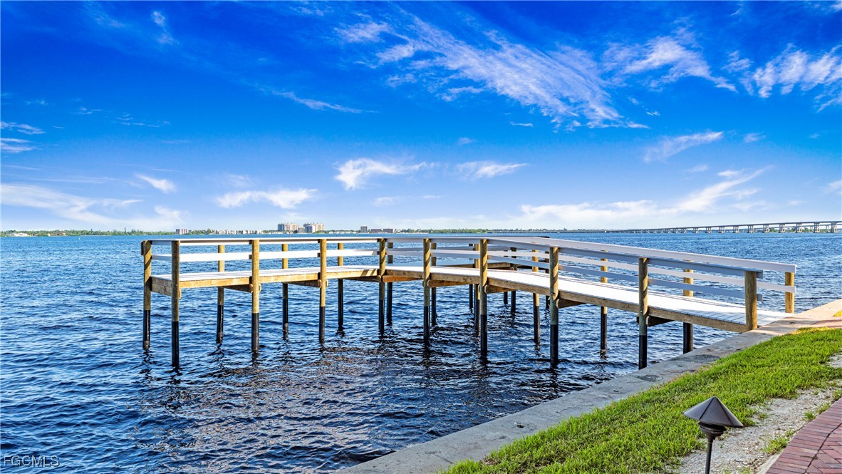 1920 Virginia Avenue, Unit 202 Fort Myers, FL 33901 - Photo 24 of 38 a view of a swimming pool with a table and chairs in balcony