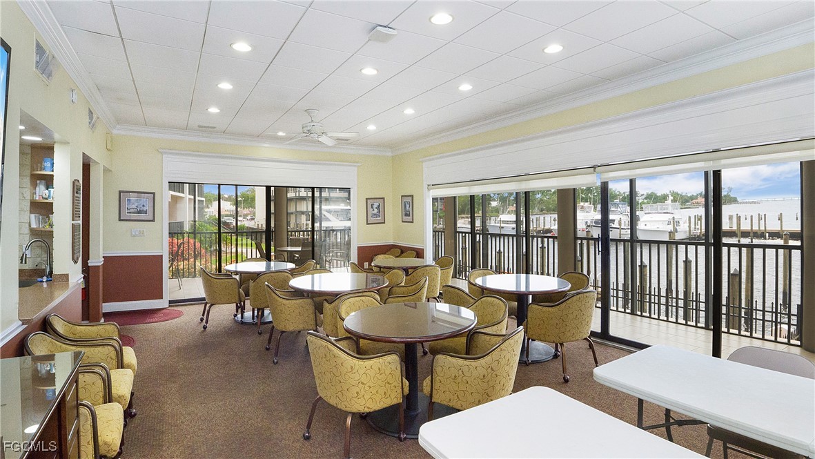 1920 Virginia Avenue, Unit 202 Fort Myers, FL 33901 - Photo 26 of 38 a view of a dining room with furniture window and outside view