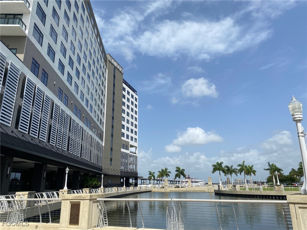 1920 Virginia Avenue, Unit 202 Fort Myers, FL 33901 - Photo 33 of 38 a view of a lake with a large building