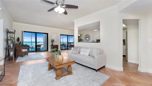 a view of a dining room with furniture and a chandelier