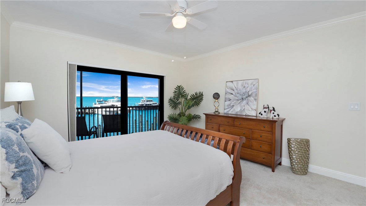 1920 Virginia Avenue, Unit 202 Fort Myers, FL 33901 - Photo 9 of 38 a bed room with a bed and a chandelier