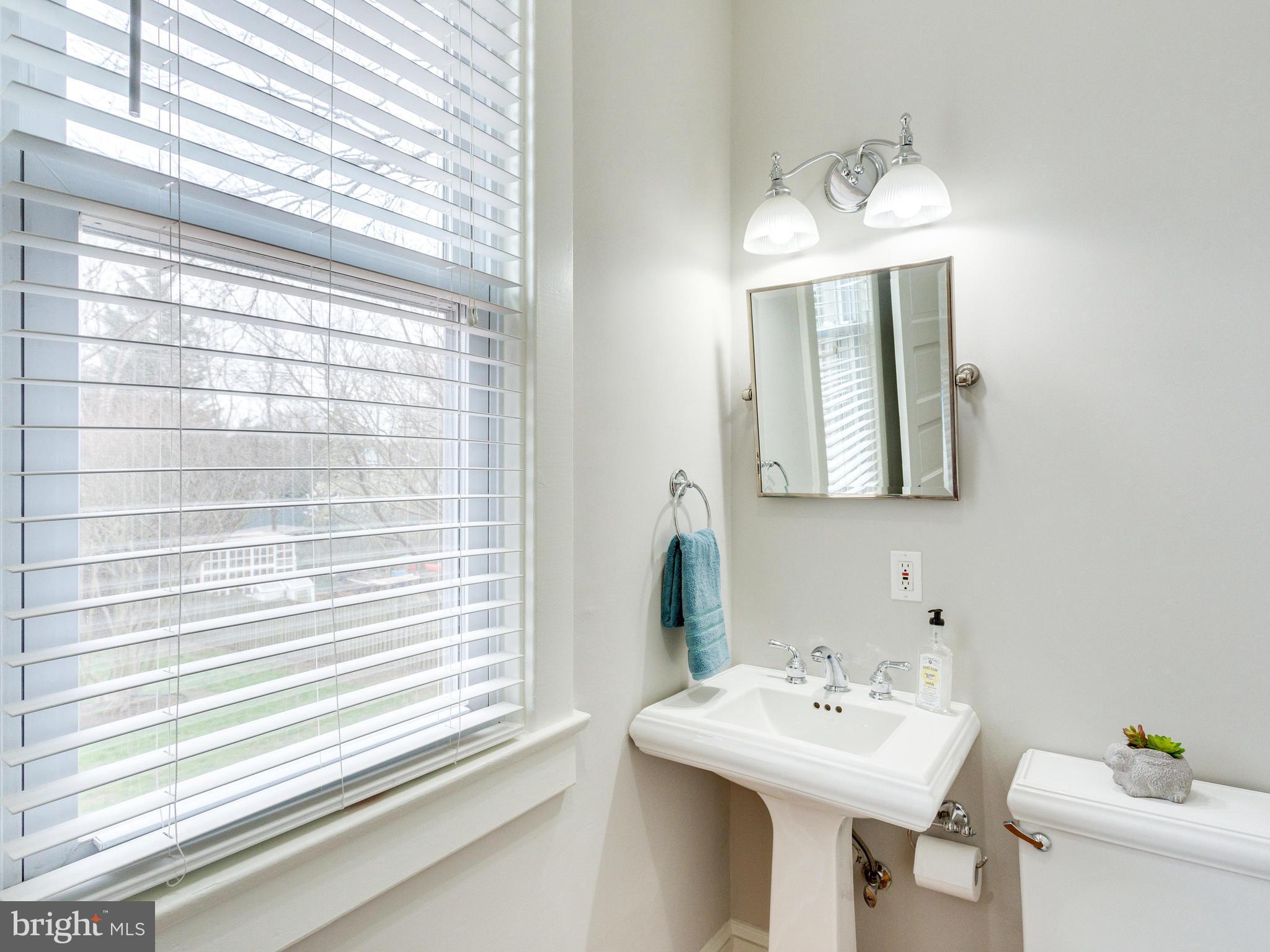 1107 Russell Road Alexandria, VA 22301 - Photo 12 of 29 a bathroom with a sink and a mirror