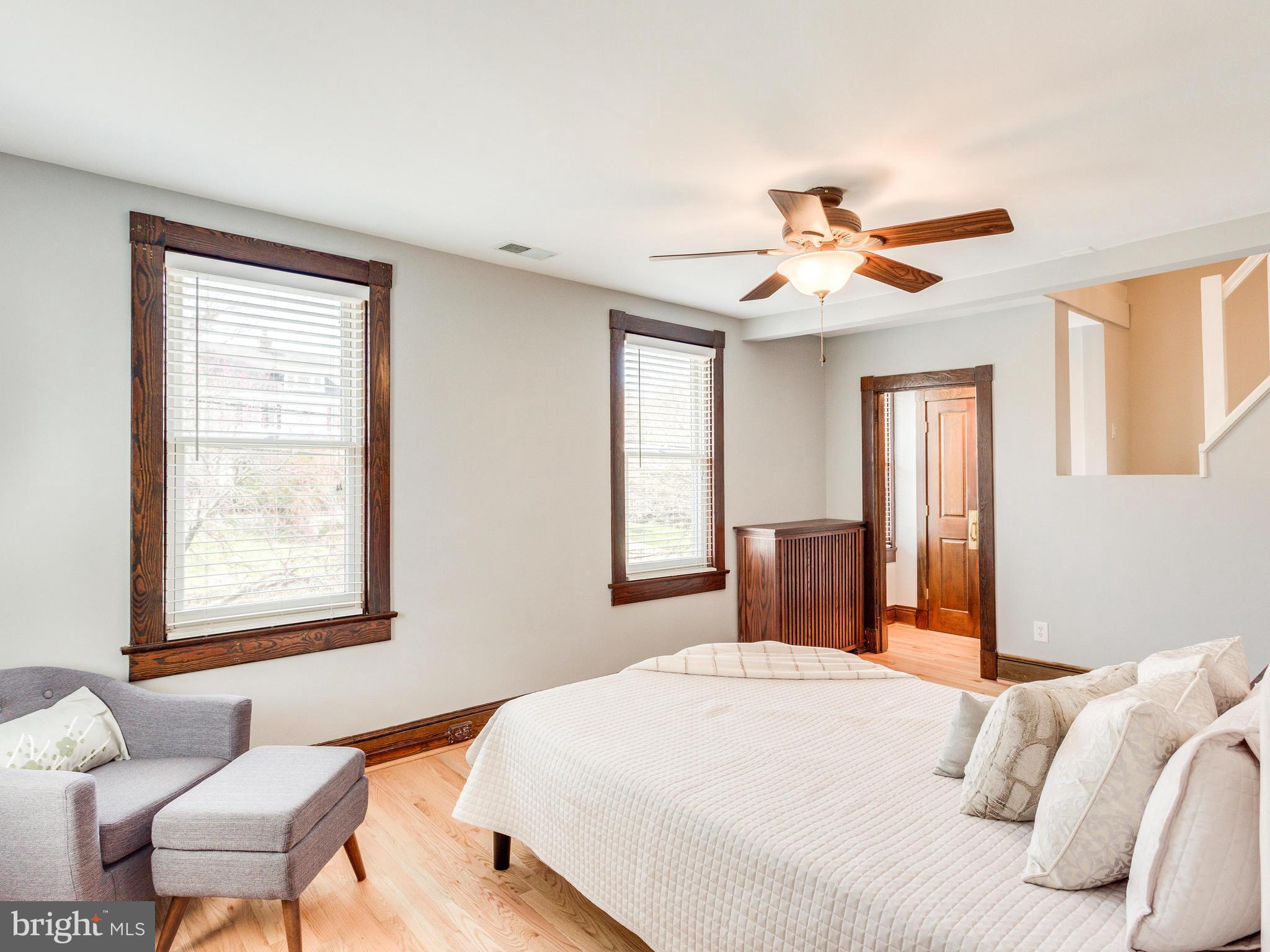1107 Russell Road Alexandria, VA 22301 - Photo 14 of 29 a bedroom with a large bed desk and a window