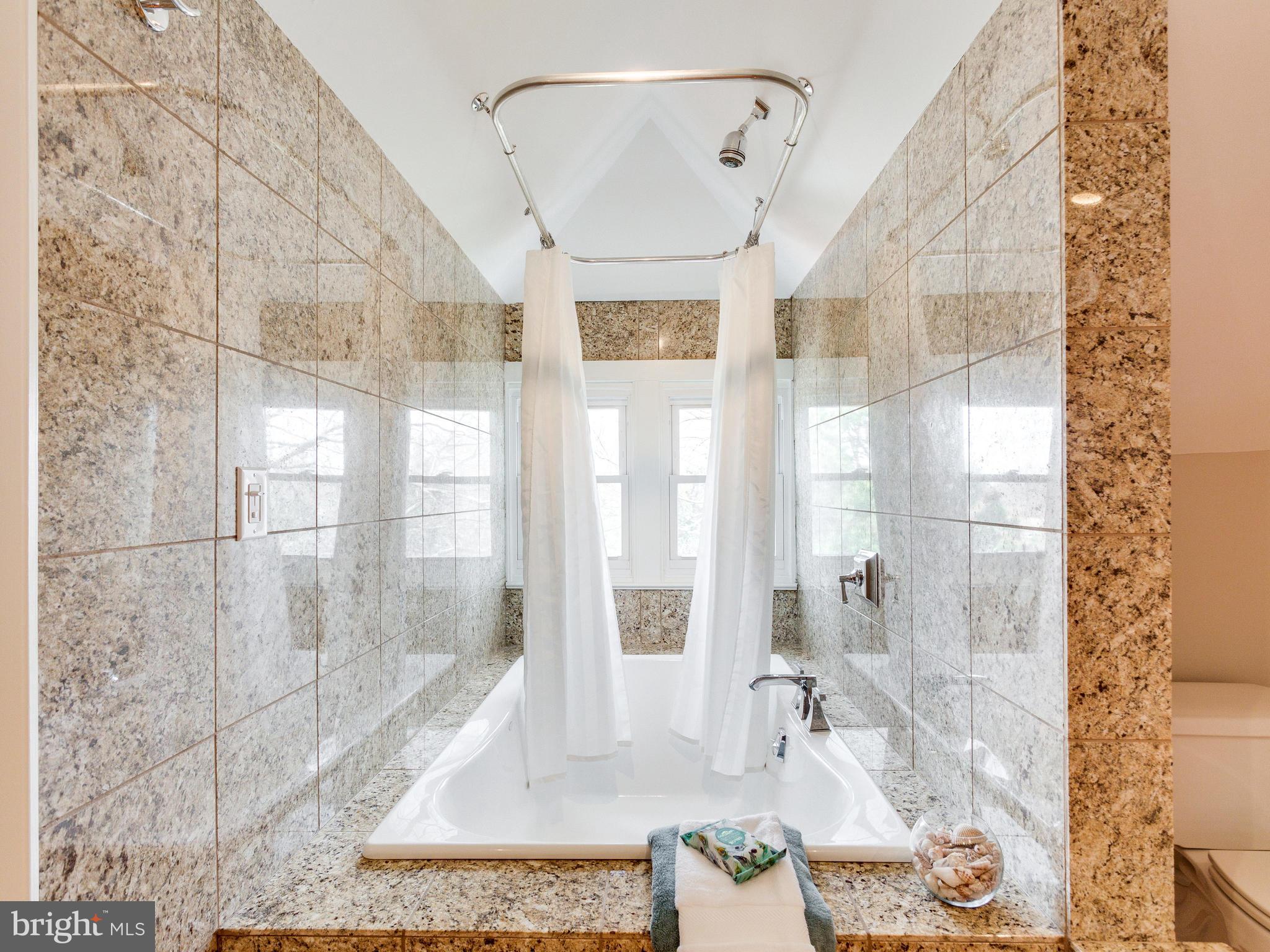 1107 Russell Road Alexandria, VA 22301 - Photo 18 of 29 a bathroom with a glass shower